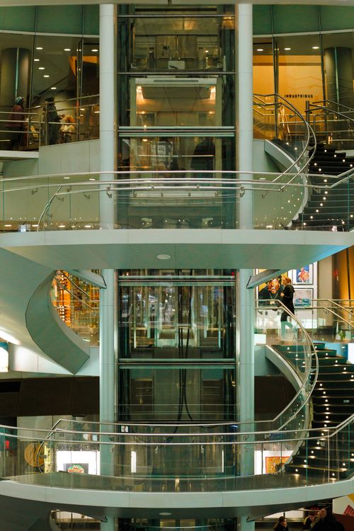 Modern elevator and staircase inside a UAE shopping mall