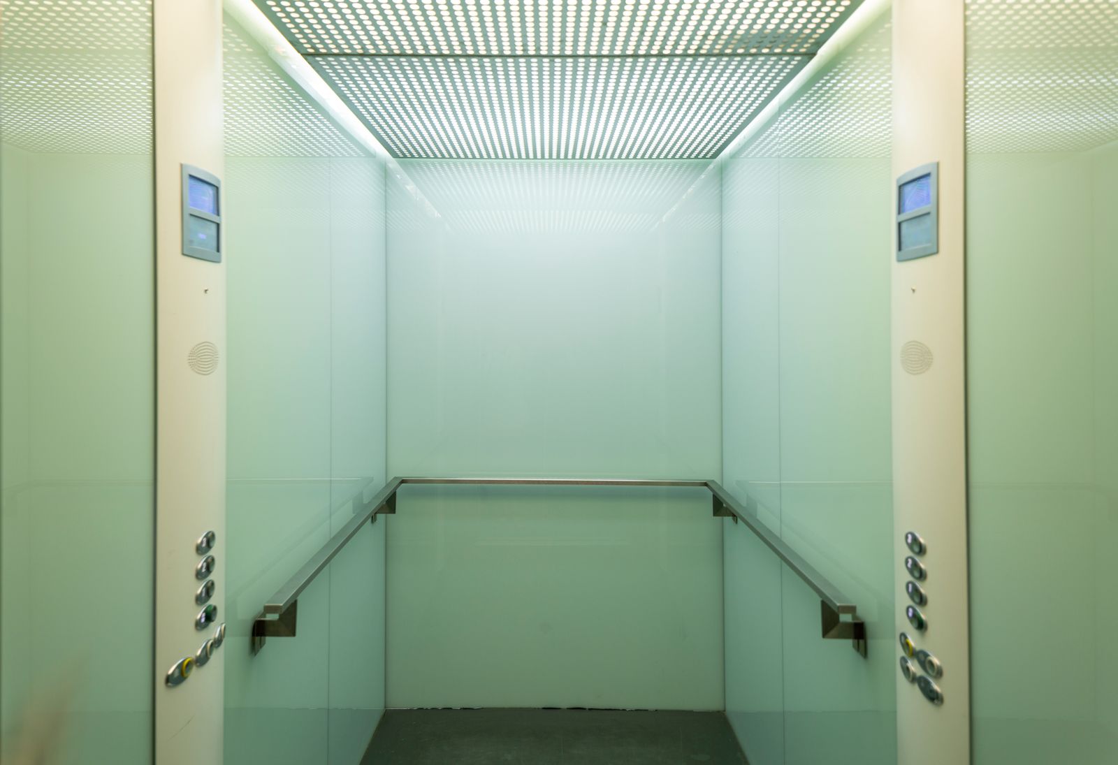 Interior of an elevator cabin showing the safety and control systems facility managers rely on during outages