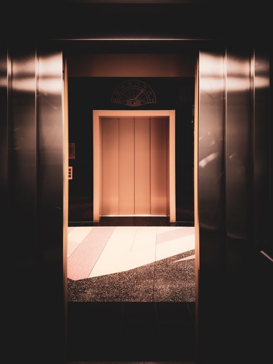 Modern energy-efficient elevator interior with warm LED lighting in a UAE commercial building